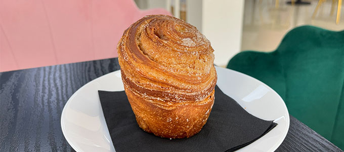 a cruffin on a table in Patisserie Luxe - a patisserie in Poole