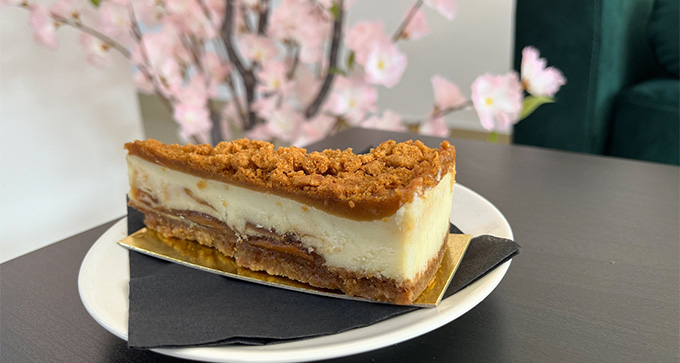 a Biscoff Cheescake on a table in Patisserie Luxe - a cake shop in Poole